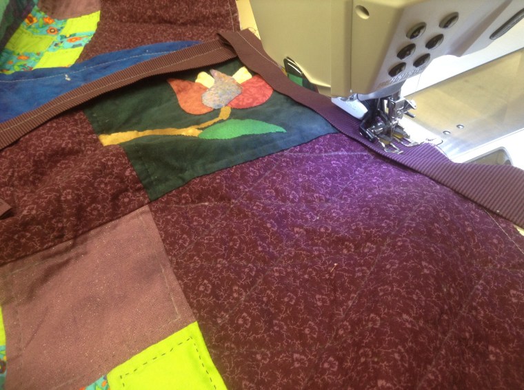 Sewing a binding on a quilt for a friend!