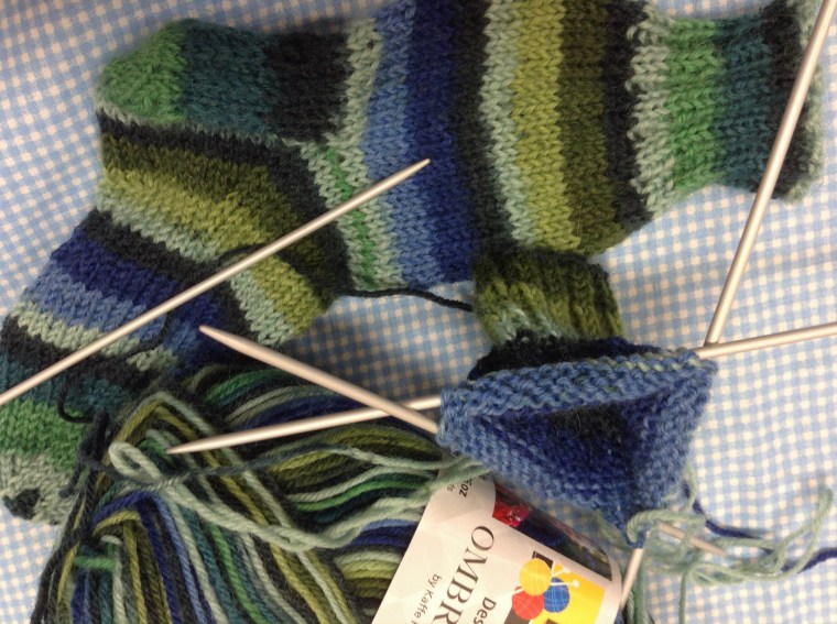 Buzy knitting socks for a 2 year old little man.